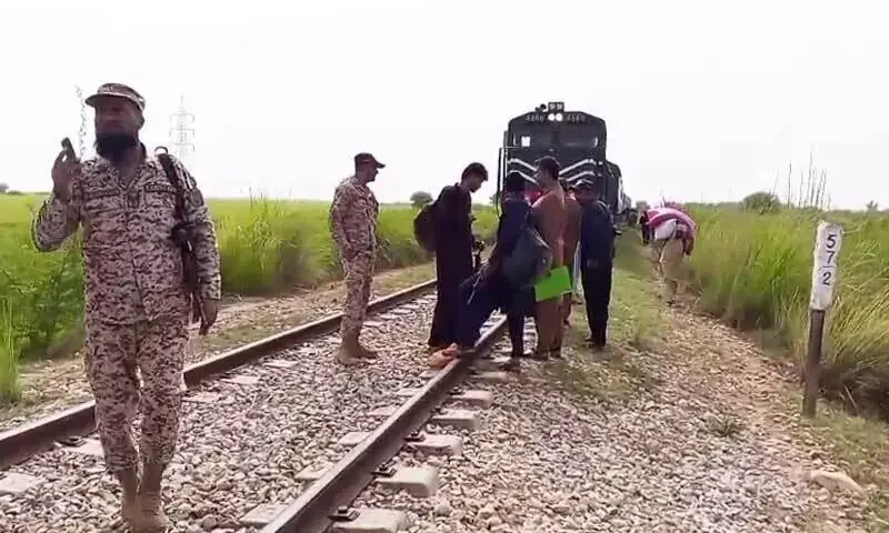 Image shows the aftermath of derailment of four bogies of the Jaffar Expr&shy;ess following an explosion on the track near the town of Huma&shy;yoon, in the Shikarpur district on October 7. &mdash; DawnNewsTV
