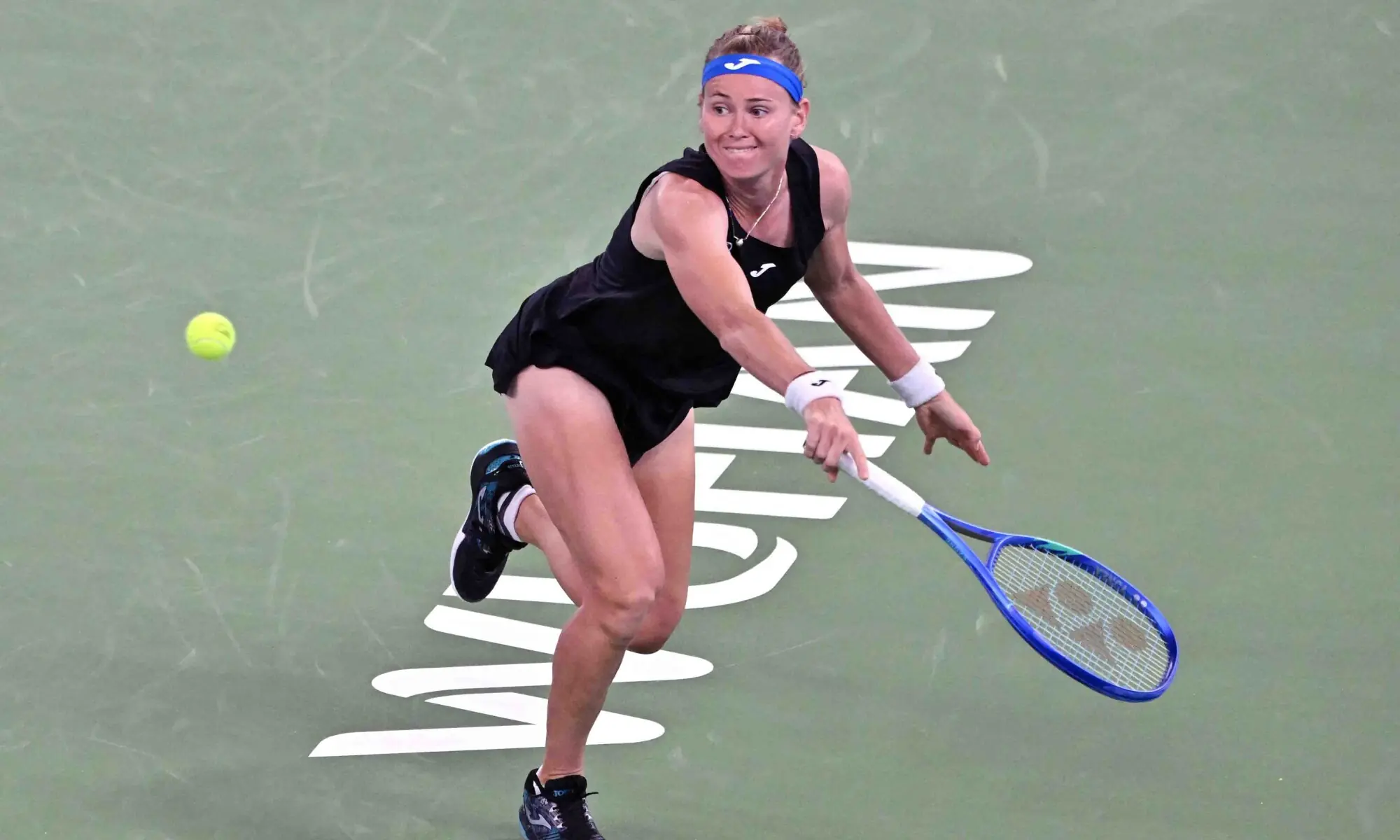 MARIE Bouzkova of the Czech Republic hits a return against Poland&rsquo;s Iga Swiatek during their Wuhan Open match on Tuesday.&mdash;AFP