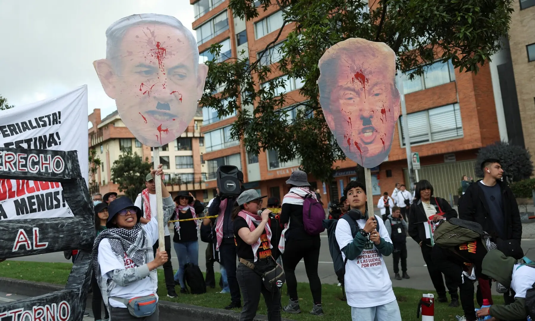 Demonstrators hold signs depicting Israeli Prime Minister Benjamin Netanyahu and US President Donald Trump during a pro-Palestinian protest after Israeli forces intercepted the vessels of the Global Sumud Flotilla, in Bogota, Colombia on October 7, 2025. — Reuters/Luisa Gonzalez