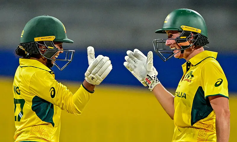 Australia&rsquo;s Alana King (L) celebrates with teammate Beth Mooney after scoring a half-century (50 runs) during the ICC Women&rsquo;s Cricket World Cup 2025 one-day international (ODI) match between Australia and Pakistan at the R. Premadasa International Cricket Stadium in Colombo on October 8, 2025. &mdash; AFP