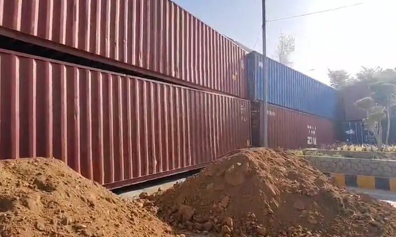 Containers placed on  a blocked road. &mdash; DawnNewsTV