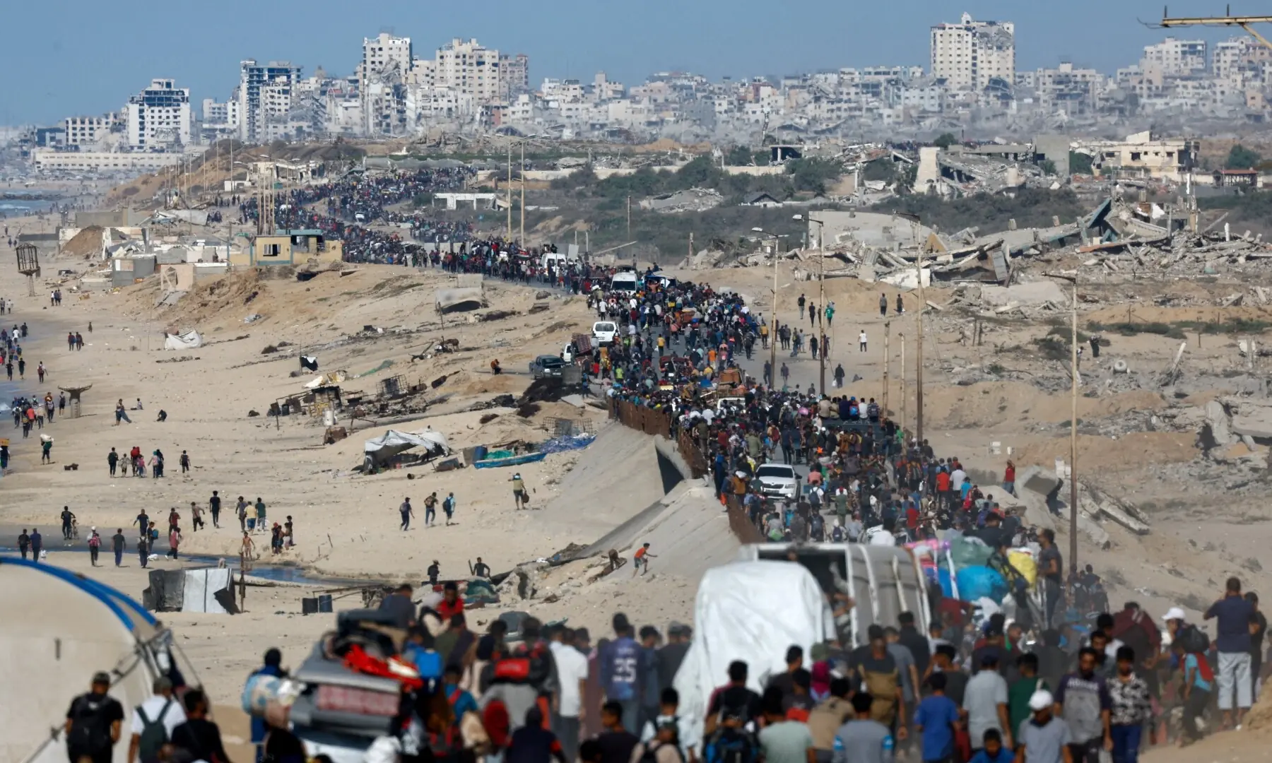  Palestinians, who were displaced to the southern part of Gaza at Israel&rsquo;s order during its war on Gaza, make their way along a road as they return to the north after a ceasefire between Israel and Hamas in Gaza went into effect, in the central Gaza Strip on Oct 10, 2025. &mdash; Reuters/Mahmoud Issa 