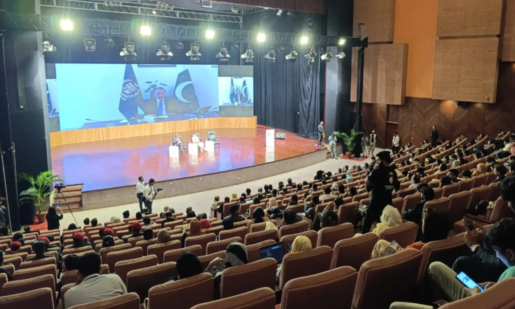 Participants listen to Climate Change Minister Musadik Malik. — Dawn