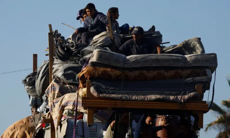 Palestinians, who were displaced to the southern part of Gaza at Israel&rsquo;s order, make their way along a road as they return to the north, amid a ceasefire between Israel and Hamas in Gaza, in the central Gaza Strip, on October 11, 2025. &mdash; Reuters