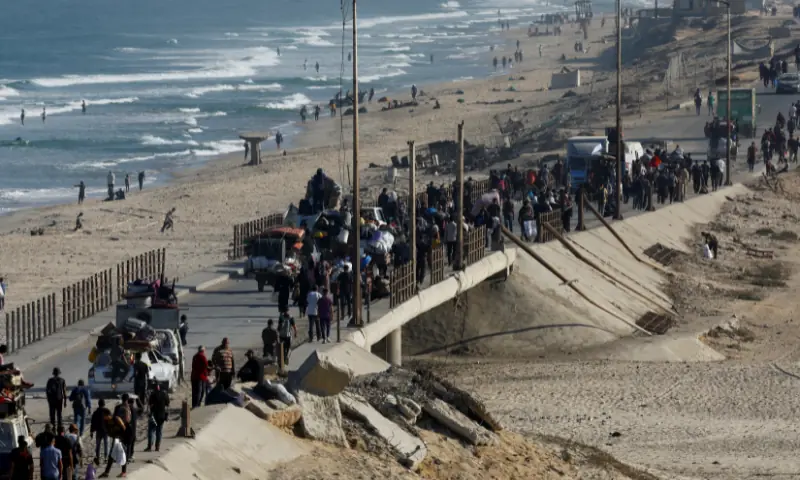 Palestinians, who were displaced to the southern part of Gaza at Israel&rsquo;s order, make their way along a road as they return to the north, amid a ceasefire between Israel and Hamas in Gaza, in the central Gaza Strip, on October 11, 2025. &mdash; Reuters