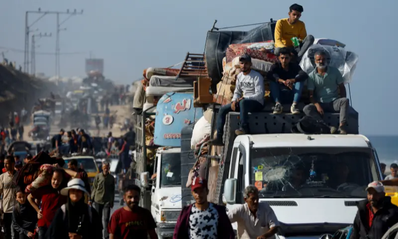Palestinians, who were displaced to the southern part of Gaza at Israel&rsquo;s order, make their way along a road as they return to the north, amid a ceasefire between Israel and Hamas in Gaza, in the central Gaza Strip, on October 11, 2025. &mdash; Reuters