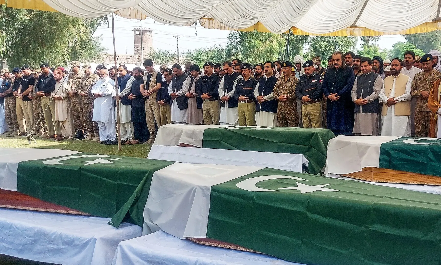 KP Chief Minister Ali Amin Gandapur, who submitted his resignation twice, joins security personnel and others at the funeral of the cops martyred in the overnight attack on the police training school. — AFP KP Chief Minister Ali Amin Gandapur, who submitted his resignation twice, joins security personnel and others at the funeral of the cops martyred in the overnight attack on the police training school. — AFP