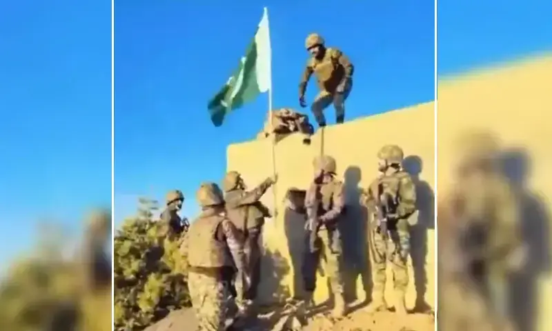 This is a screengrab from a video shared by state-broadcaster PTV News. The description with the video states that it shows Pakistan Army personnel hoisting the national flag at an Afghan post in a border area near the South Waziristan district. &mdash; Screengrab via video shared by PTV News on X