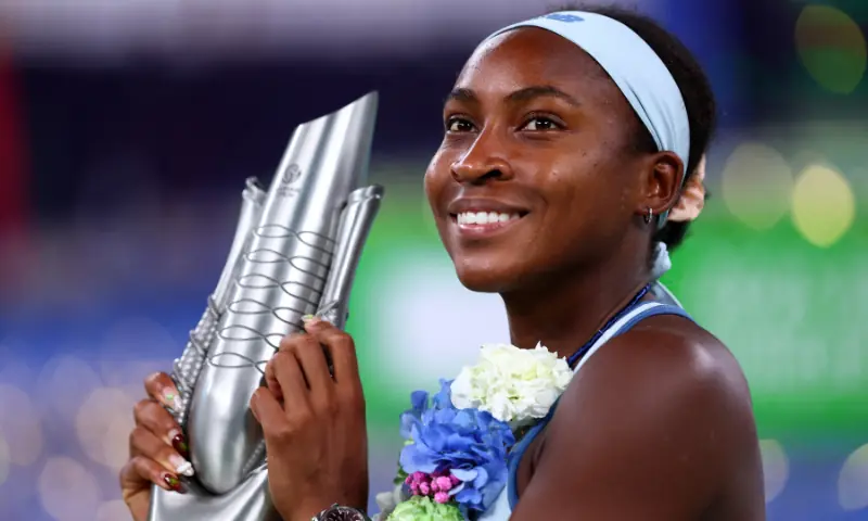 Tennis - WTA 1000 - Wuhan Open - Optics Valley International Tennis  Coco Gauff of the US celebrates with the trophy after winning the final against Jessica Pegula of the US. &mdash; Reuters