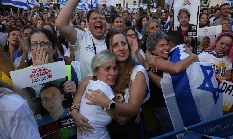 Israelis react as they wait for the release of Israelis still held in Gaza at Hostage Square in Tel Aviv early on Oct 13, 2025. — AFP