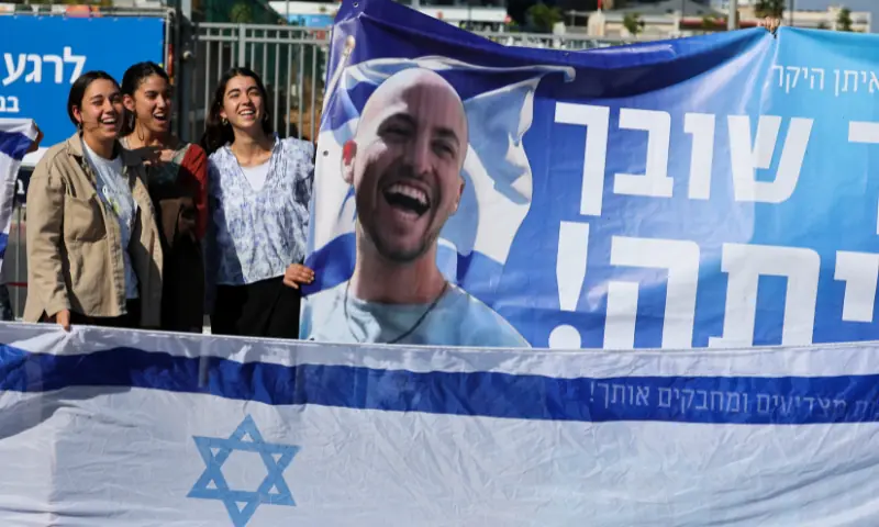 People gather while waiting for the arrival of hostages, who were kidnapped during the October 7, 2023 attack by Hamas and taken to Gaza, as they are released as part of a hostages-prisoners swap and a ceasefire deal in Gaza between Hamas and Israel, at the site of Beilinson Schneider complex, in Petah Tikva, Israel, on October 13. &mdash; Reuters