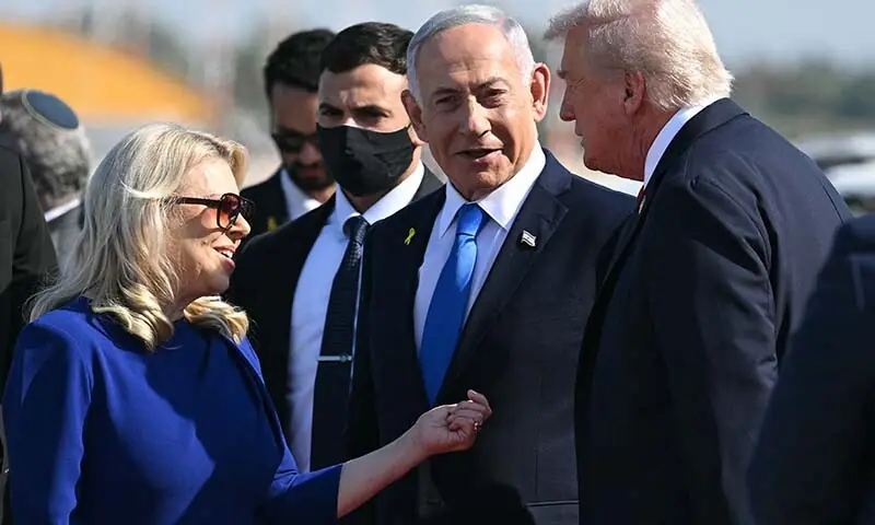 Israel’s Prime Minister Benjamin Netanyahu and his wife Sara greet US President Donald Trump (R) upon his arrival at Ben Gurion Airport on the outskirts of Lod near Tel Aviv on October 13. — AFP