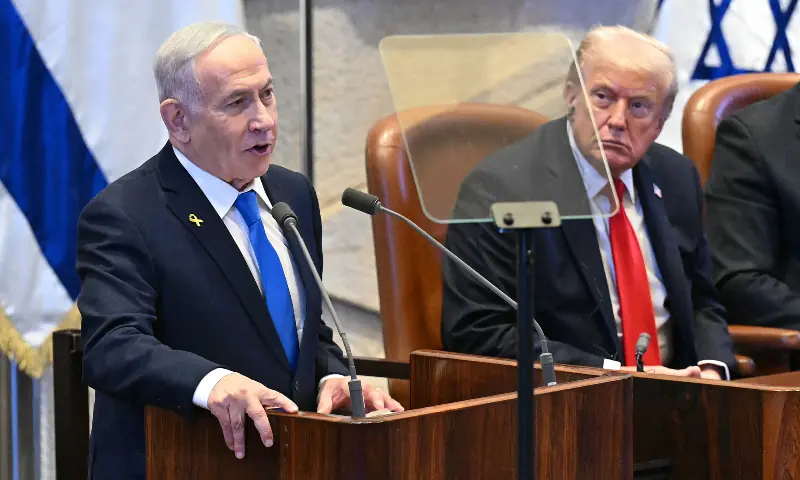  US President Donald Trump (R) listens to Israeli Prime Minister Benjamin Netanyahu as he addresses the Israeli parliament, the Knesset, in Jerusalem on October 13, 2025. &mdash; AFP 