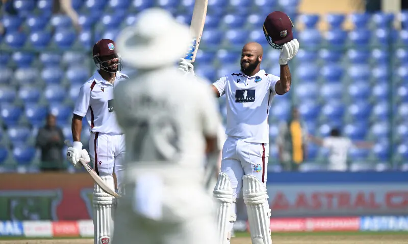 West Indies&rsquo; John Campbell (R) celebrates after scoring a century (100 runs) during the fourth day of the second and last Test cricket match between India and West Indies at the Arun Jaitley Stadium in New Delhi on October 13, 2025. &mdash; AFP