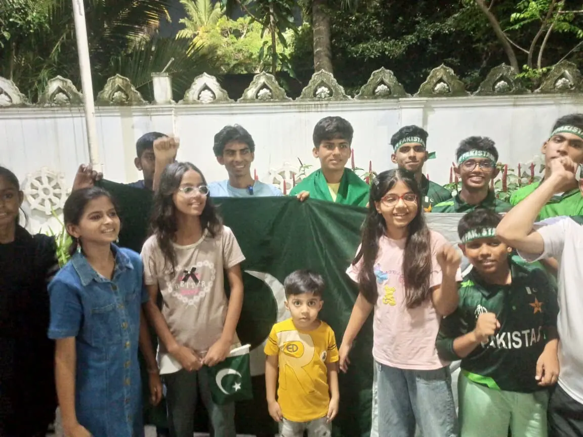 Pakistan supporters pose with the flag at the R. Pramedasa Stadium in Colombo. — Photo via author