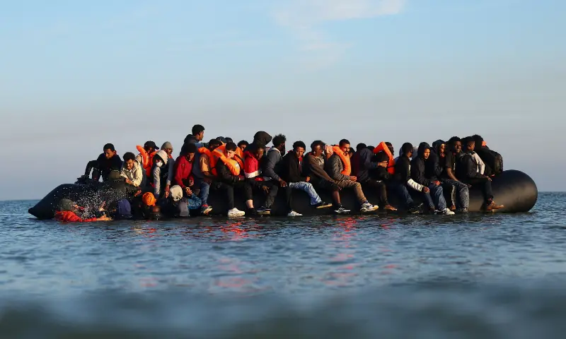 A group of migrants on an inflatable dinghy leave the beach of Petit-Fort-Philippe in northern France in an attempt to cross the English Channel to reach Britain, in Gravelines near Calais, France on September 27, 2025. &mdash; Reuters