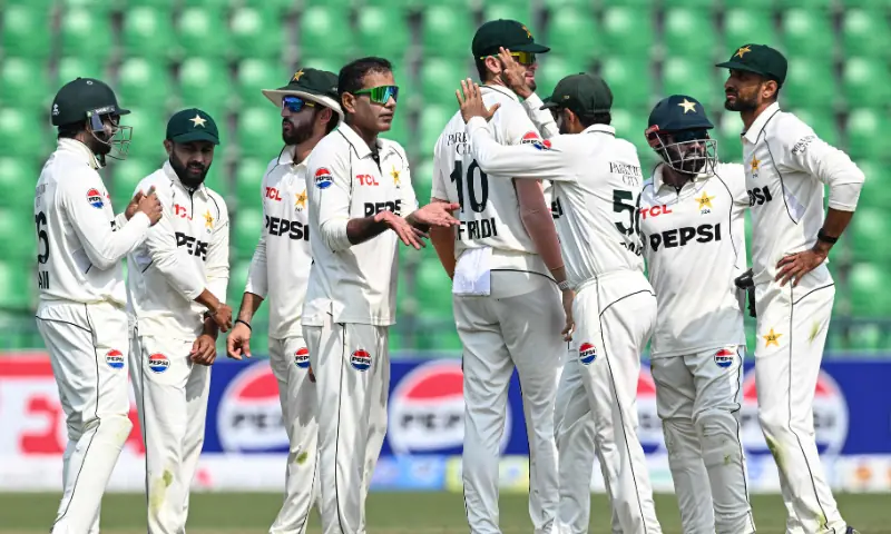 Pakistan&rsquo;s Noman Ali (C) celebrates with teammates after taking the wicket of South Africa&rsquo;s Dewald Brevis during the fourth day of the first Test match between Pakistan and South Africa at the Gaddafi Stadium in Lahore on October 15, 2025. &mdash; AFP