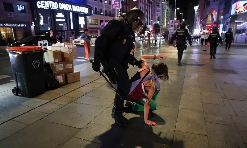 A police officer detains a demonstrator during a general strike called by Spanish unions in solidarity with Palestinians in Gaza, in Madrid, Spain, on October 15. &mdash; Reuters