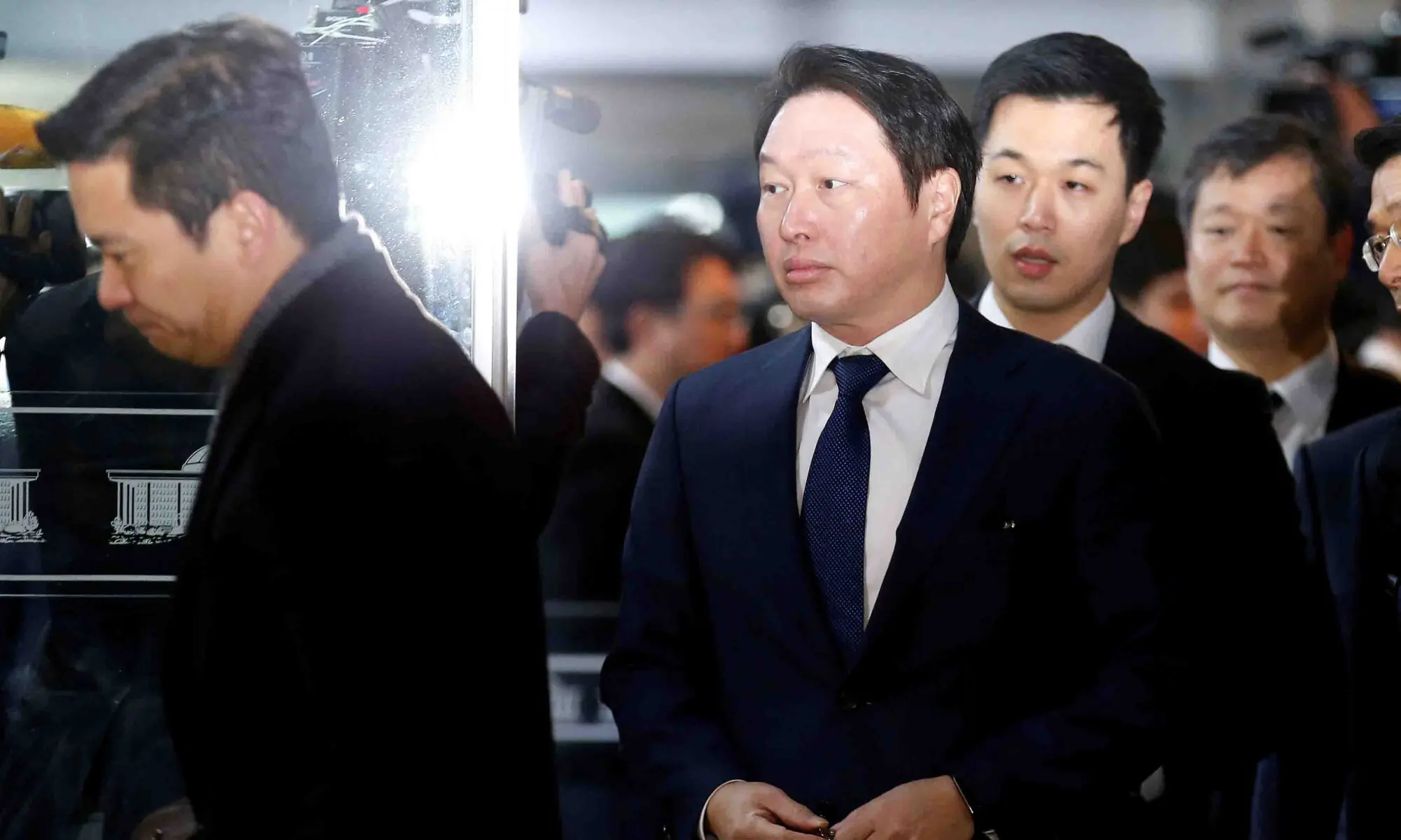 SK Group Chairman Chey Tae-won arrives to attend a hearing at the National Assembly in Seoul, South Korea, December 6, 2016. &mdash; Reuters