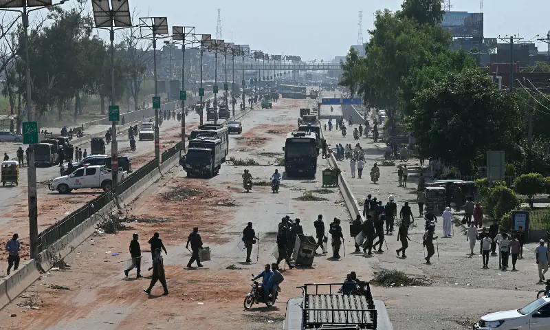 Police personnel patrol a street following crackdown on Tehreek-e-Labbaik Pakistan (TLP) party activists during an anti-Israel protest in Muridke on October 13, 2025. &mdash; AFP