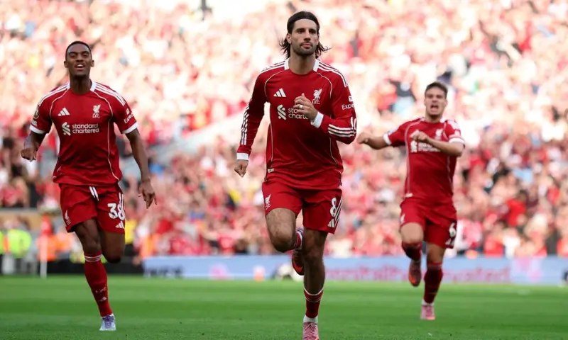 Liverpool&rsquo;s Dominik Szoboszlai celebrates scoring their first goal with Ryan Gravenberch and Milos Kerkez in Anfield, Liverpool, Britain on August 31, 2025. &mdash; Reuters/File