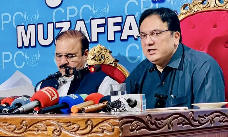 AJK Finance Minister Abdul Majid Khan (right) and Food Minister Chaudhry Akbar Ibrahim speak at a press conference in Muzaffarabad on October 17. &mdash; Photo via author
