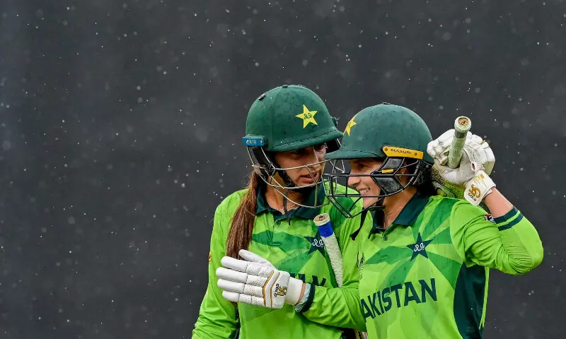 Pakistan&rsquo;s Aliya Riaz (L) and Natalia Pervaiz walk off the field as rain stops play during the ICC Women&rsquo;s Cricket World Cup 2025 one-day international (ODI) match between New Zealand and Pakistan at the R. Premadasa International Cricket Stadium in Colombo on October 18, 2025.
&mdash; AFP