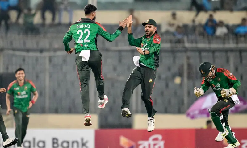 A pitch invader (R) runs to embrace Bangladesh&rsquo;s Tanvir Islam during the first one-day international (ODI) cricket match between Bangladesh and West Indies at the Sher-e-Bangla National Cricket Stadium in Dhaka on October 18, 2025. &mdash; AFP
