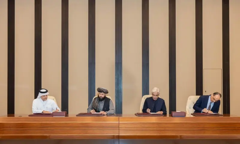 Defence Minister Khawaja Asif (centre right) and Afghan Defence Minister Maulvi Sahib Muhammad Yaqub Mujahid (centre left) sign ceasefire agreement between Pakistan and Afghanistan on Sunday, October 19 in Doha, Qatar. &mdash; X/@MofaQatar_EN