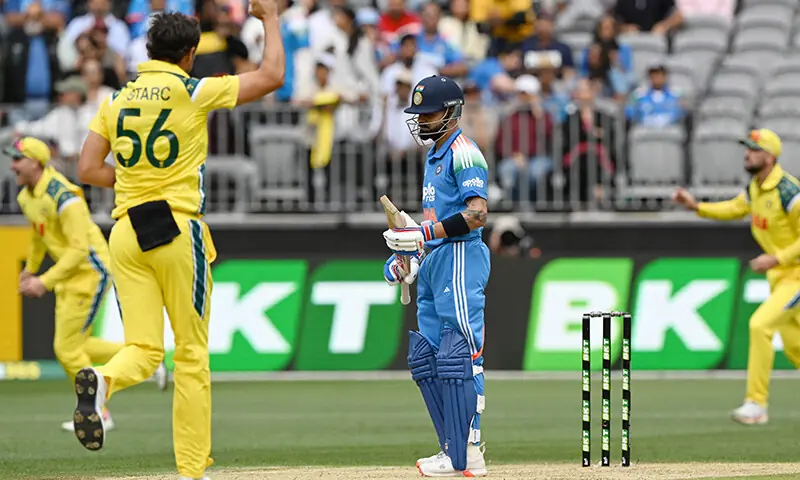 India&rsquo;s Virat Kohli (C) reacts as Australia&rsquo;s pacer Mitchell Starc (front L) celebrates his wicket during the first one-day international cricket match between Australia and India in Perth on October 19, 2025.  &mdash; AFP