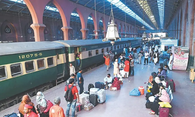 Passengers wait for their train at a Lahore Railway station in this file photo. &mdash; Dawn/File