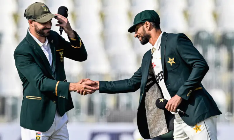 Pakistan&rsquo;s captain Shan Masood (R) shakes hands with his South African counterpart Aiden Markram after the toss before the start of the first day of the second Test cricket match between Pakistan and South Africa at the Rawalpindi Cricket Stadium in Rawalpindi on October 20, 2025. &mdash; AFP