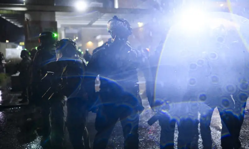 Anti-ICE protesters clash with federal agents at the US Immigration and Customs Enforcement building in Portland, Oregon, US on October 18, 2025. &mdash; AFP