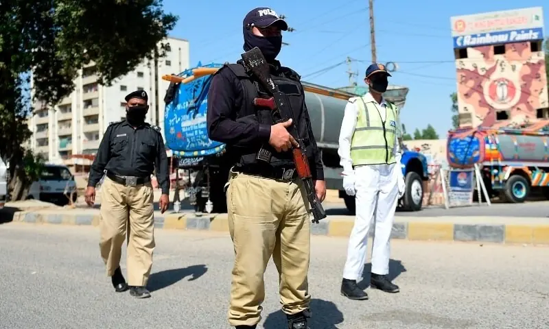 Policemen stand guard after cordoning an area during a government-imposed nationwide lockdown in Karachi on April 12, 2020. &mdash; AFP/File