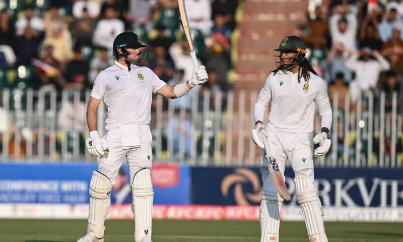 South Africa&rsquo;s Tristan Stubbs (L) celebrates after scoring half century (50 runs) as his teammate Tony de Zorzi watches during the second day of the second Test cricket match between Pakistan and South Africa at the Rawalpindi Cricket Stadium in Rawalpindi on October 21, 2025. &mdash; AFP