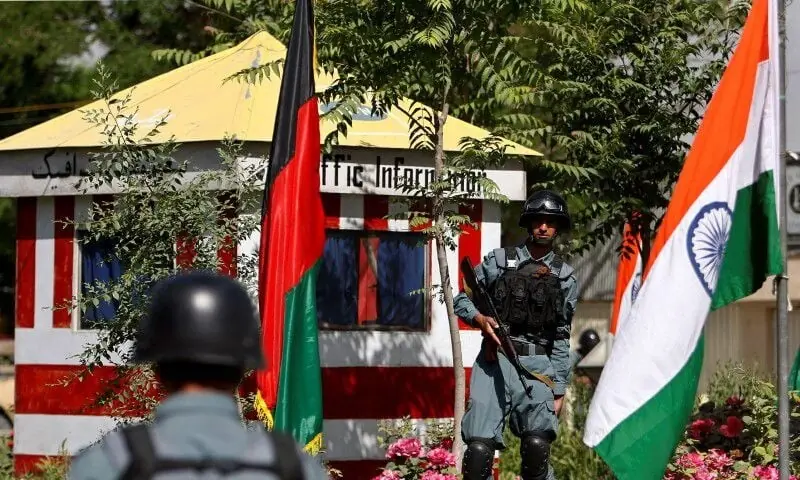 Afghan policemen stand guard next to Indian and Afghan national flags, at a check point in Kabul, Afghanistan, May 12, 2011. &mdash; Reuters/File
