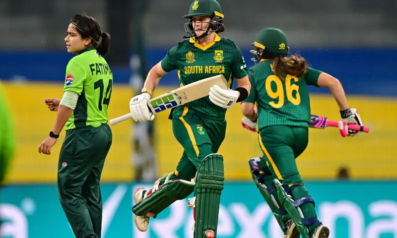 South Africa&rsquo;s captain Laura Wolvaardt (C) and Sune Luus (R) run between the wickets as Pakistan&rsquo;s captain Fatima Sana looks on during the ICC Women&rsquo;s Cricket World Cup 2025 one-day international (ODI) match between Pakistan and South Africa at the R. Premadasa International Cricket Stadium in Colombo on October 21, 2025. &mdash; AFP