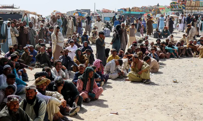Afghan citizens wait to register as they attempt to return to their country, with trucks loaded with their belongings seen in the background, after Pakistan closed border crossings for trade with Afghanistan following exchanges of fire between the two nations&rsquo; forces, at the Chaman border crossing in Balochistan Province, Pakistan on October 18, 2025. &mdash; Reuters