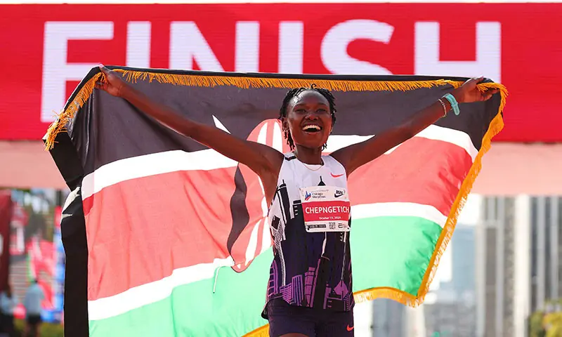 Ruth Chepngetich of Kenya celebrates after crossing the finish line to win the 2024 Chicago Marathon professional women&rsquo;s division and setting a new world record with a time of 2:09:56 at Grant Park on October 13, 2024 in Chicago, Illinois.&mdash;AFP