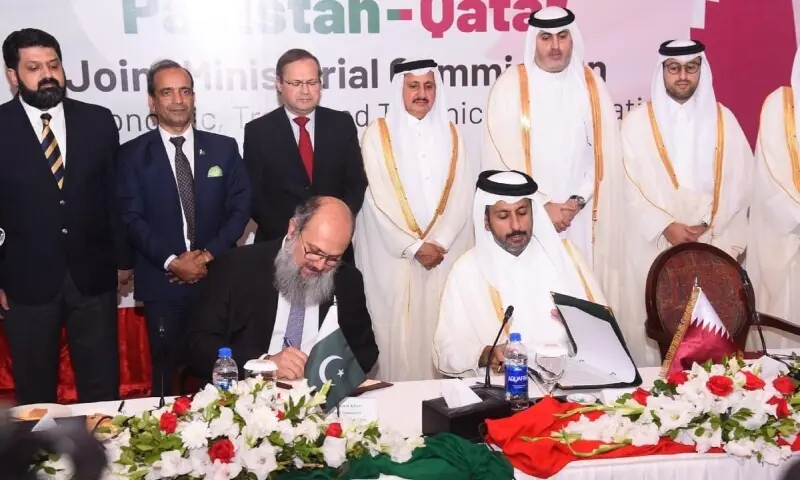 ISLAMABAD: Commerce Minister Jam Kamal Khan and his Qatari counterpart Sheikh Faisal bin Thani bin Faisal Al Thani sign an investment protocol on Thursday.—APP ISLAMABAD: Commerce Minister Jam Kamal Khan and his Qatari counterpart Sheikh Faisal bin Thani bin Faisal Al Thani sign an investment protocol on Thursday.—APP