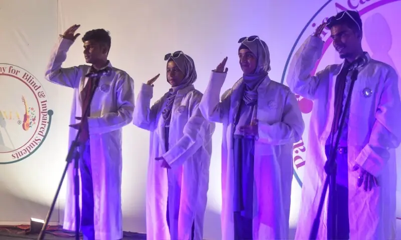 Hearing impaired and mute students of Ida Rieu use sign language to sing the national anthem. &mdash;  Fahim Siddiqi / White Star