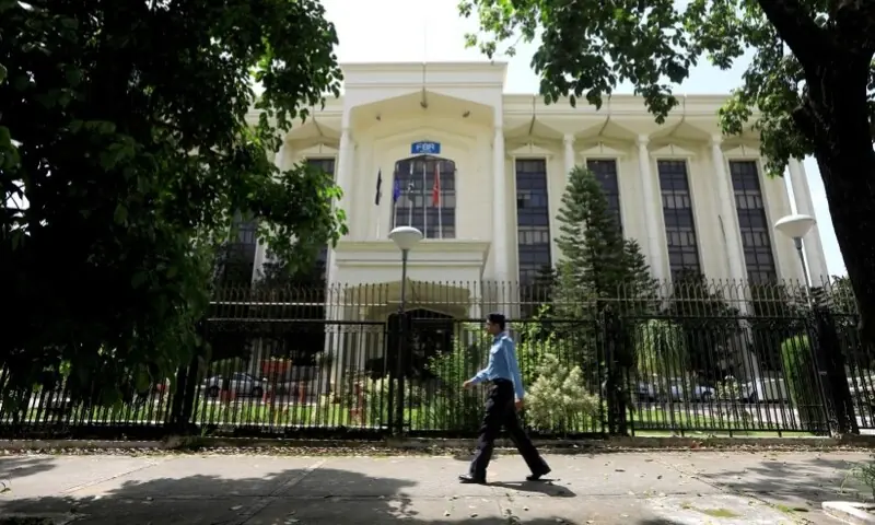 A policeman walks past the Federal Board of Revenue (FBR) office building in Islamabad, August 29, 2018. &mdash; Reuters
