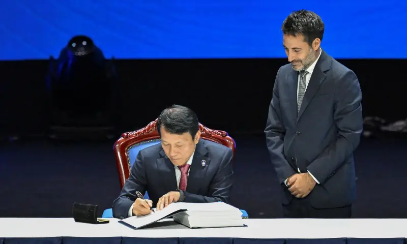 Vietnam&rsquo;s Minister of Public Security Luong Tam Quang inks his signature during the Signing Ceremony and High-Level Conference of the United Nations Convention Against Cybercrime at the National Convention Centre in Hanoi on October 25, 2025. &mdash; AFP