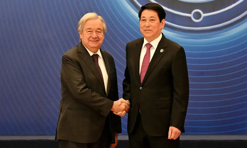 Vietnam&rsquo;s President Luong Cuong (R) shakes hands with United Nations Secretary General Antonio Guterres at the signing ceremony of the United Nations Convention against Cybercrime at the National Convention Center in Hanoi on October 25, 2025. &mdash; AFP