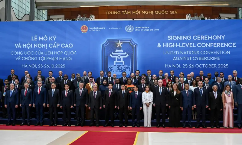 Delegates pose for photos at the signing ceremony of the United Nations Convention against Cybercrime at the National Convention Center in Hanoi on October 25, 2025. &mdash; AFP
