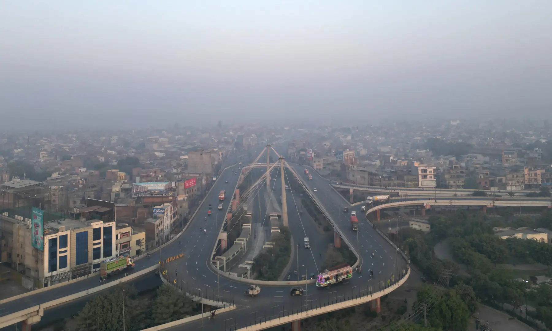 An aerial view shows the city skyline engulfed in smog in Lahore on October 25. — AFP