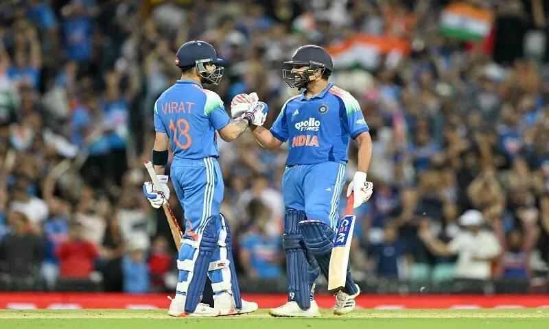 India&rsquo;s Rohit Sharma (R) and Virat Kohli celebrate their win in the third one-day international (ODI) men&rsquo;s cricket match between Australia and India at the Sydney Cricket Ground in Sydney on October 25. &mdash;AFP