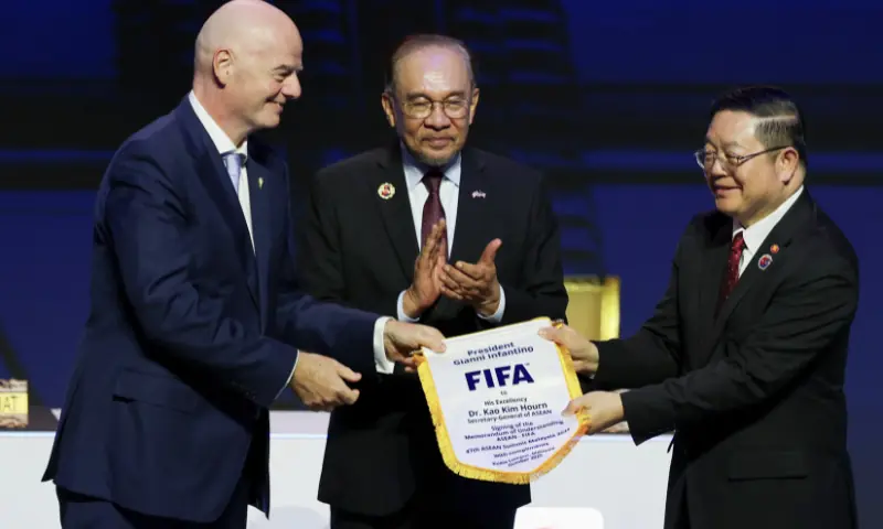 ASEAN Secretary-General Kao Kim Hourn, Malaysian Prime Minister Anwar Ibrahim and FIFA Chief Gianni Infantino attend a signing ceremony for the ASEAN-FIFA memorandum of understanding in football development on the sidelines of the 47th ASEAN Summit in Kuala Lumpur, Malaysia October 26, 2025. &mdash; Reuters