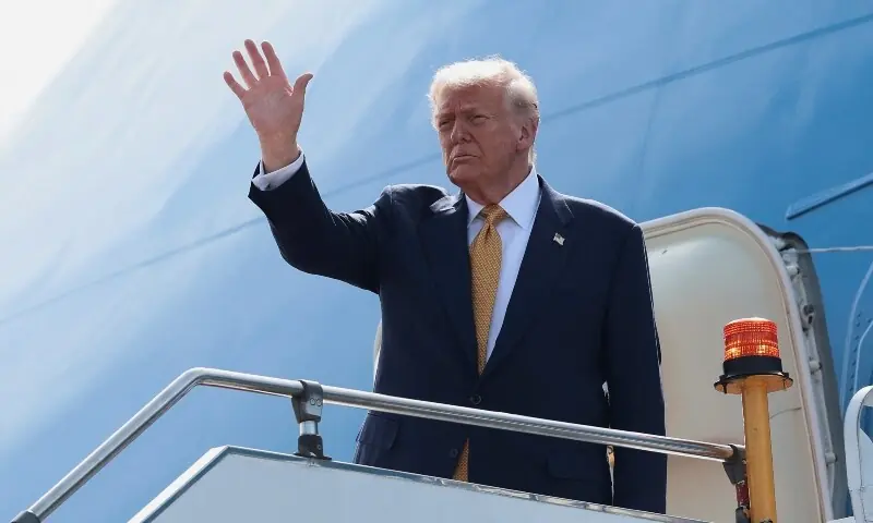 US President Donald Trump gestures while boarding Air Force One as he departs for Japan at Kuala Lumpur International Airport in Kuala Lumpur, Malaysia, October 27. &mdash; Reuters