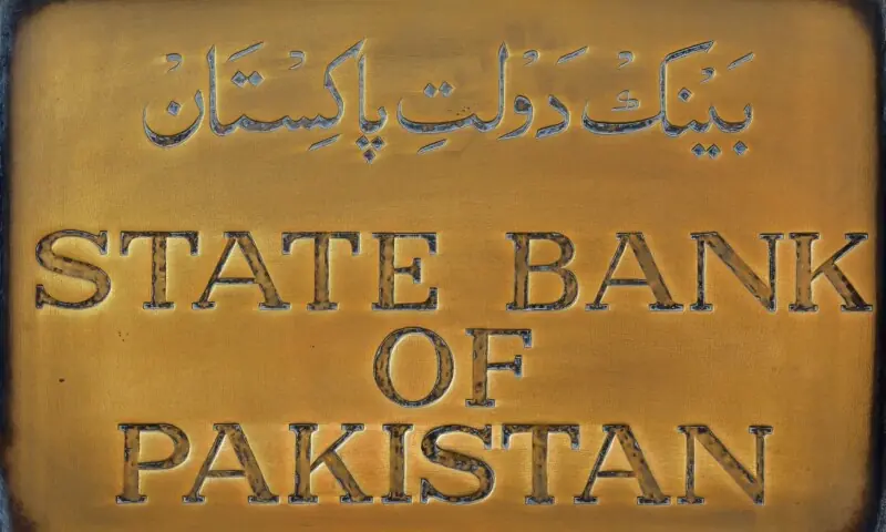 A brass plaque of the State Bank of Pakistan is seen outside of its wall in Karachi on December 5, 2018. &mdash; Reuters